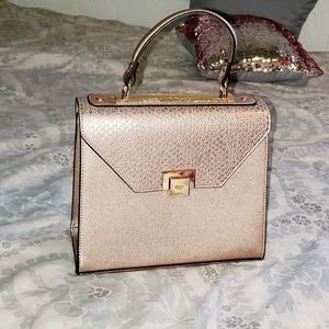 Rose gold snake print purse